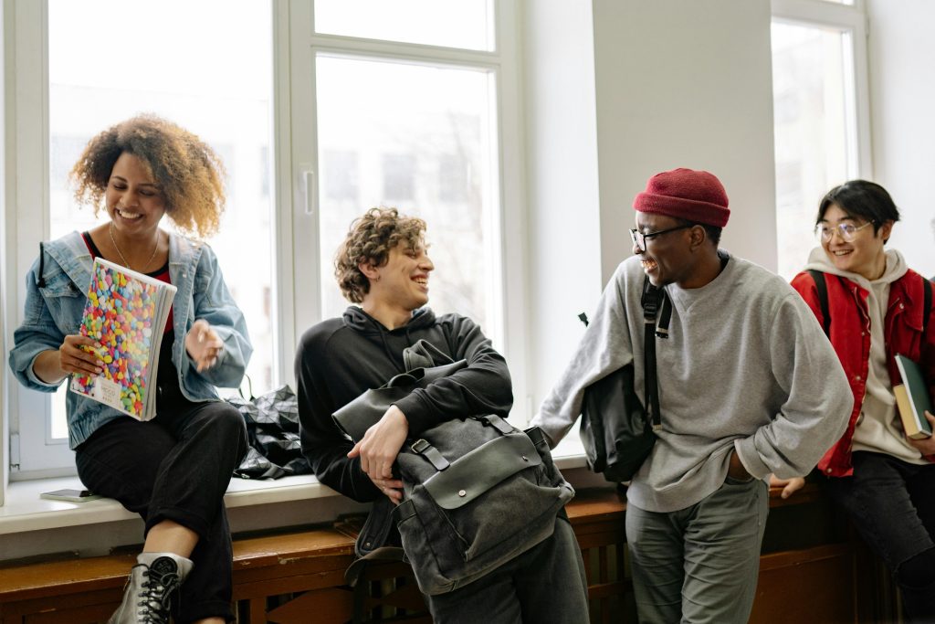 A group of young people smiling and laughing